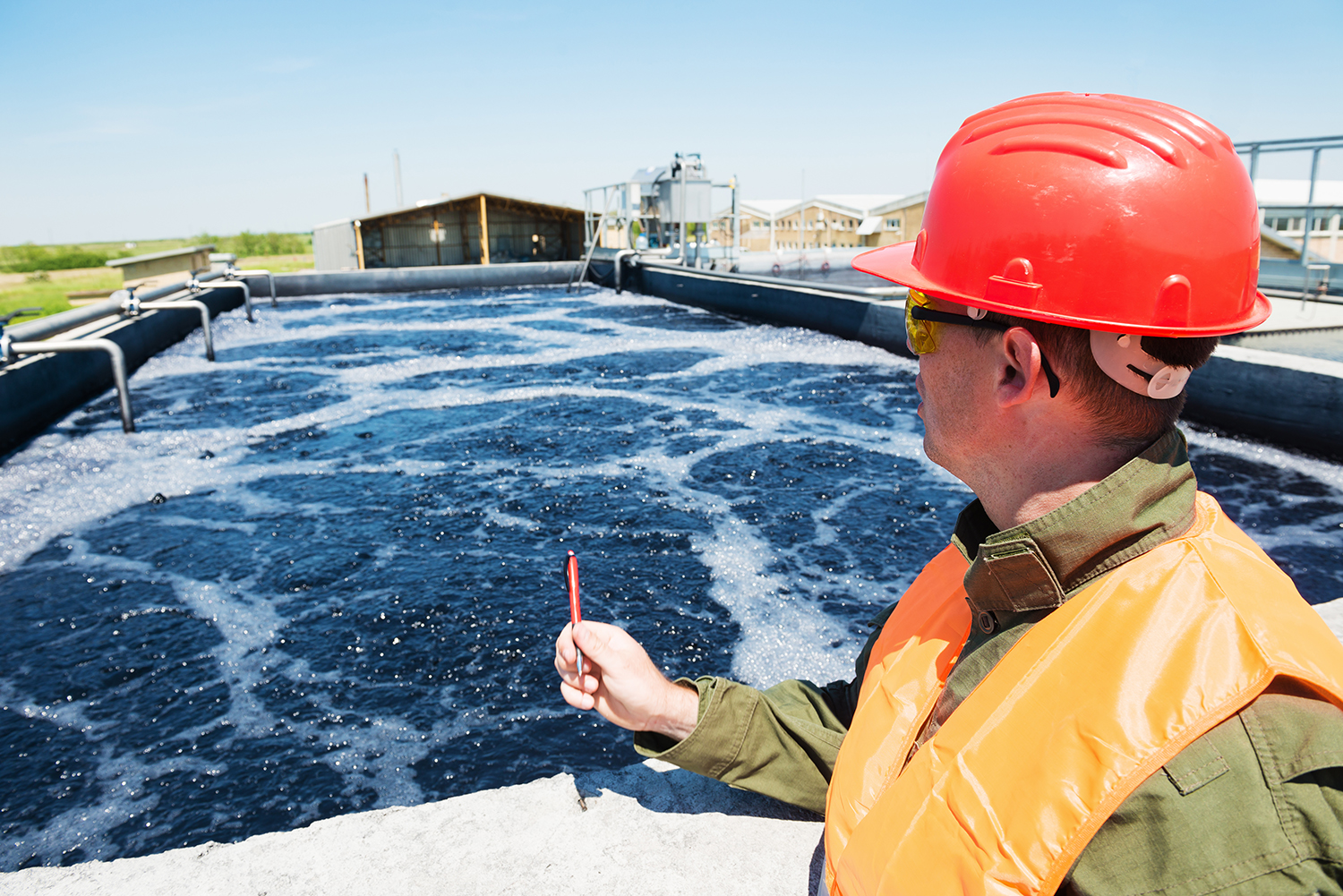 An engineer controlling a quality of water ,aerated activated sl